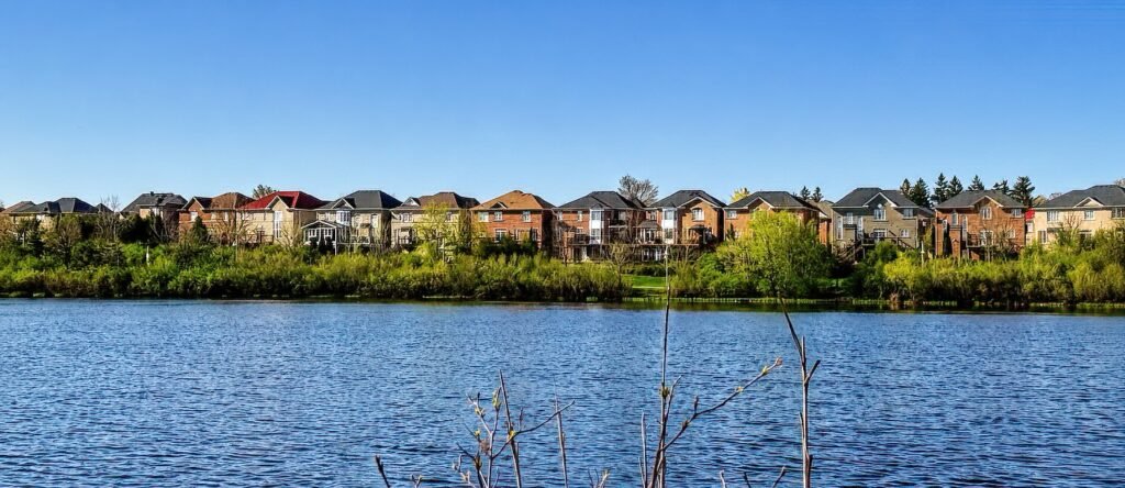 Mississauga couple reviewing selling costs and net proceeds table with real estate agent at kitchen